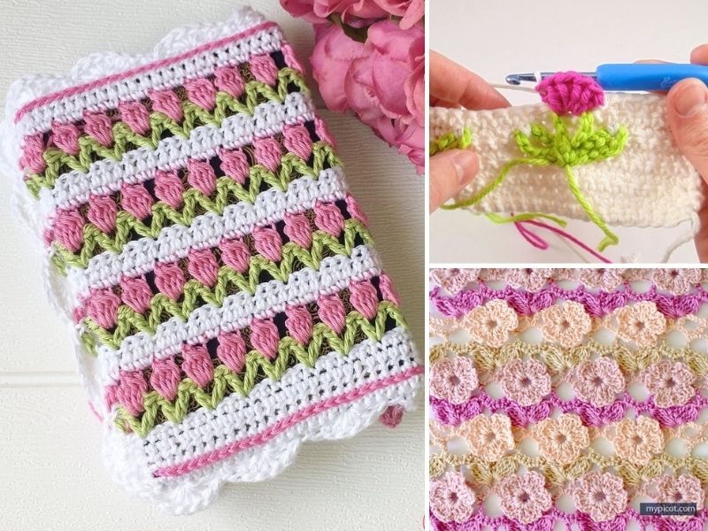 A crocheted blanket with pink flowers and a crochet hook.
