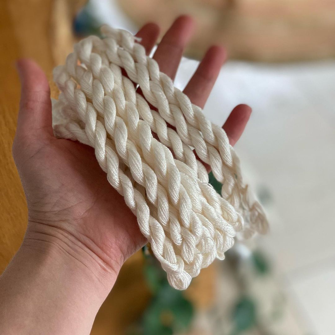 mini yarn skeins in hand